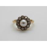 An 18ct gold Victorian ring set with a pearl to the centre surrounded by diamonds, 4.