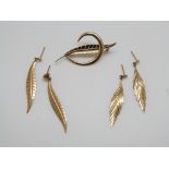A 9ct gold leaf brooch and two pairs of 9ct gold earrings, 3.