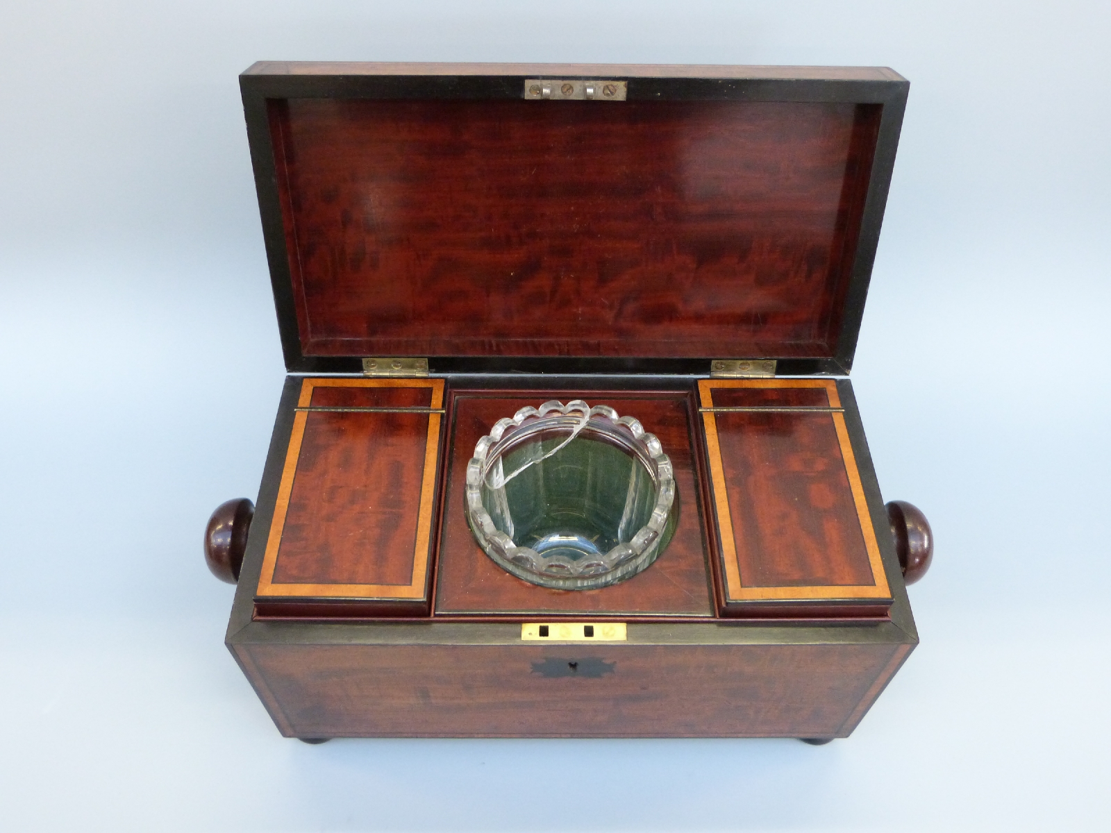 An early 19thC mahogany tea caddy of rectangular form with inlaid ebony detail, raised on bun feet, - Image 2 of 8