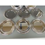 A set of eight silver plated platters, diameter 28cm,