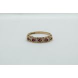 A 9ct gold ring set with alternating cubic zirconia and rubies, 2.