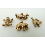 Four 9ct gold charms, elephant, duck, bear and cat, 11.