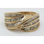 A 9ct gold ring set with round and baguette cut diamonds in a twist setting (size O)