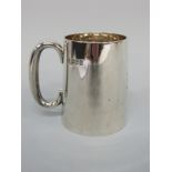 An Edward VII hallmarked silver tankard of plain tapering form,