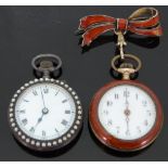 A silver ladies fob watch set with blue guilloché enamel 20mm dial and gilt inlay to the bezel and
