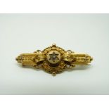A Victorian yellow metal brooch set with diamonds in a flower setting, 4.