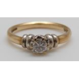 A 9ct gold ring set with a round cut diamond of approximately 0.