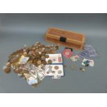 A collection of UK coinage in a wooden box, to include farthings, Queen Victoria pennies,