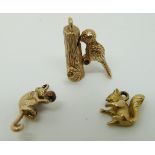 Three 9ct gold charms including woodpecker, squirrel and monkey, 7.