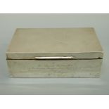 A hallmarked silver cigarette box with engine turned lid, marks rubbed, length 15.