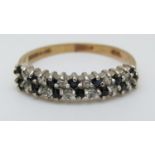 A 9ct gold ring set with sapphires and cubic zirconia (size M)