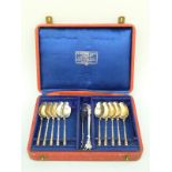 A cased set of ten French white metal teaspoons with nips, Paris silver marks,