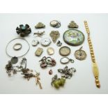 A collection of jewellery to include silver charms, silver ring, silver brooch, a seal,