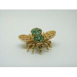 A 14ct gold brooch/ pendant in the form of an insect set with emeralds, 2.