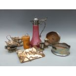 A collection of plated ware to include a pair of wine coasters, Mauchline ware glass holder,