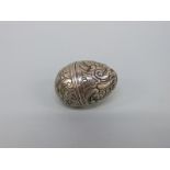 A late 18th/early 19thC white metal pomander or spice holder of ovoid form with two part screw