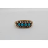 A Victorian ring set with a four turquoise cabochons surrounded by rose cut diamonds (size K)