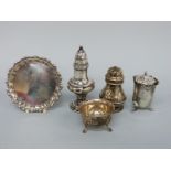 Five pieces of silver to include three pepper pots, open salt and miniature salver, diameter 8.