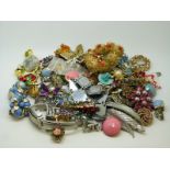 A collection of costume jewellery including brooches, earrings,