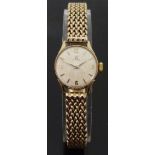 Omega 9ct gold ladies wristwatch with gold hands, baton markers and Arabic numerals,