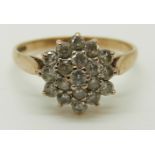 A 9ct gold ring set with cubic zirconia in a cluster, 2.