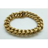 An 18ct gold curb link bracelet with textured detail, 57.