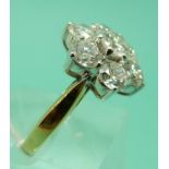 An 18ct gold ring set with seven round brilliant cut diamonds,