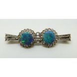 An Art Deco 9ct white gold brooch set with two opal doublets surrounded by rose cut diamonds, 4.