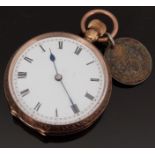 A 9ct gold ladies pocket watch with Roman numerals, blued hands and white enamel dial,