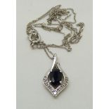 A 9ct white gold pendant set with a sapphire and diamonds on 9ct white gold chain, 1.