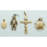 A 9ct gold teddy bear pendant, a 9ct gold cross pendant and two 9ct gold religious pendants, 4.