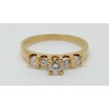 An 18ct gold ring set with five diamonds, 2.