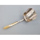 A Georgian hallmarked silver and mother of pearl caddy spoon formed as a shovel,