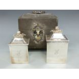 A pair of George III hallmarked silver tea caddies with flower finials in original two division