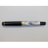 Pelikan fountain pen with grey marbled body and visible reservoir