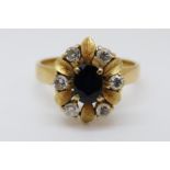 An 18ct gold ring set with an oval sapphire of approximately 0.