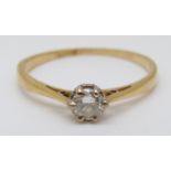 An 18ct gold ring set with a round cut diamond of approximately 0.35ct, 2.