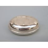 A continental white metal snuff/trinket box with engraved coronets and heraldic shields,