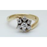 A 14ct gold ring set with diamonds in a cluster, total diamond weight approximately 0.
