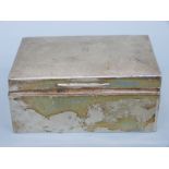An Edward VII hallmarked silver cigarette box, London 1909 maker's mark rubbed, length 13.