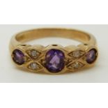 A 9ct gold ring set with amethysts and diamonds (size M)