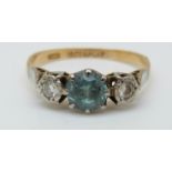 An 18ct gold ring set with a zircon and two diamonds in a platinum setting (size L)