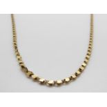A 9ct gold necklace, 10.