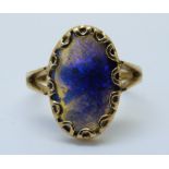 A 18ct gold ring set with a large oval opal cabochon (size M)