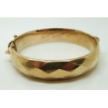 A 9ct gold faceted bangle, Chester 1961, 18.