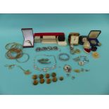 A collection of costume jewellery etc to include diamante military buttons, travelling clock,