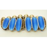 A silver bracelet set with blue guilloche enamel in oval panels by David Andersen,