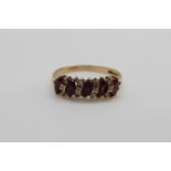 A 9ct gold ring set with rubies and diamonds, 2.