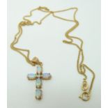 A 9ct gold pendant set with opals in a cross on a 9ct gold chain, 3.