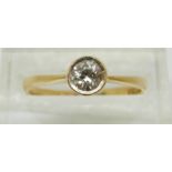 An 18ct gold ring set with a round cut diamond of approximately 0.22ct, 2.